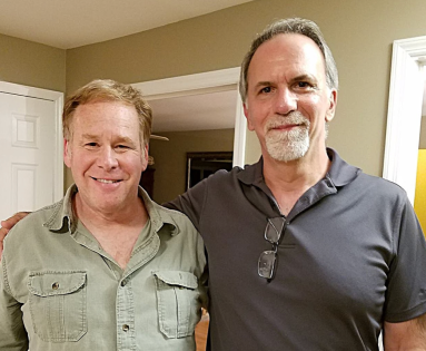 Westbury friends standing next to each other in a house.